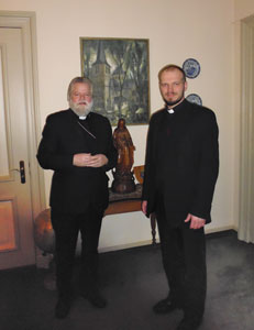 Bezoek priester Litouwse gemeenschap